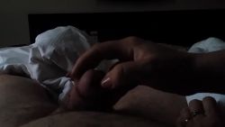 I stroke my hubby’s nice hard cock under the sheets