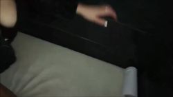 She sucks off several guys in the backstage area of a sex shop